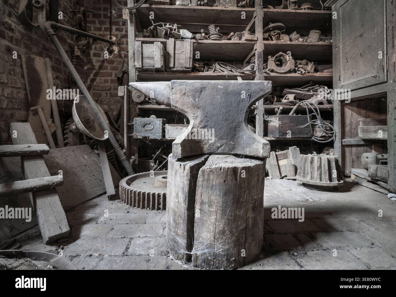 Historic anvil in a abandoned workshop. Stock Photo
