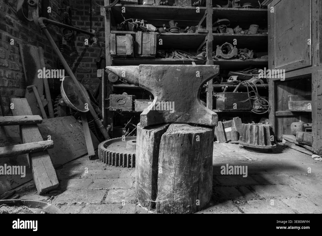 Historic anvil in a abandoned workshop. Stock Photo