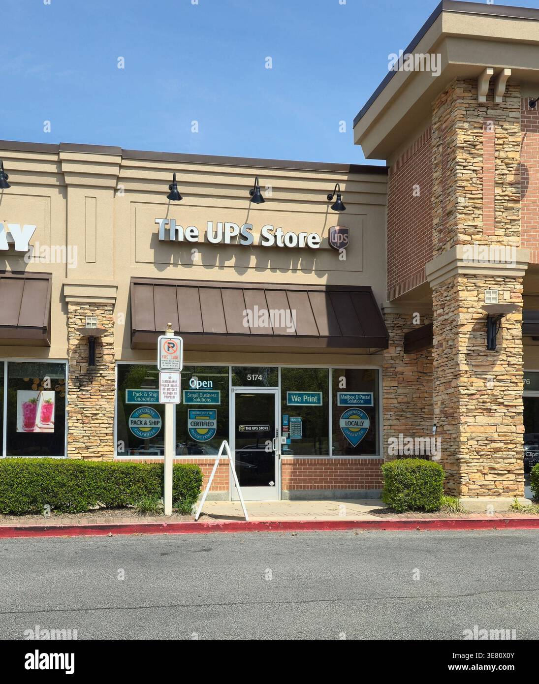 The UPS Store retail location with signage and storefront in shopping ...