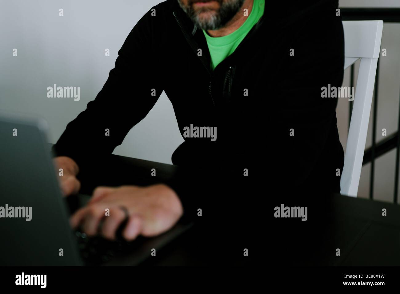 Vibe Coding Software Engineer Developing Billion Dollar Applications at Kitchen Table on Saturday Morning - AI Vibe Coder Concept Stock Photo