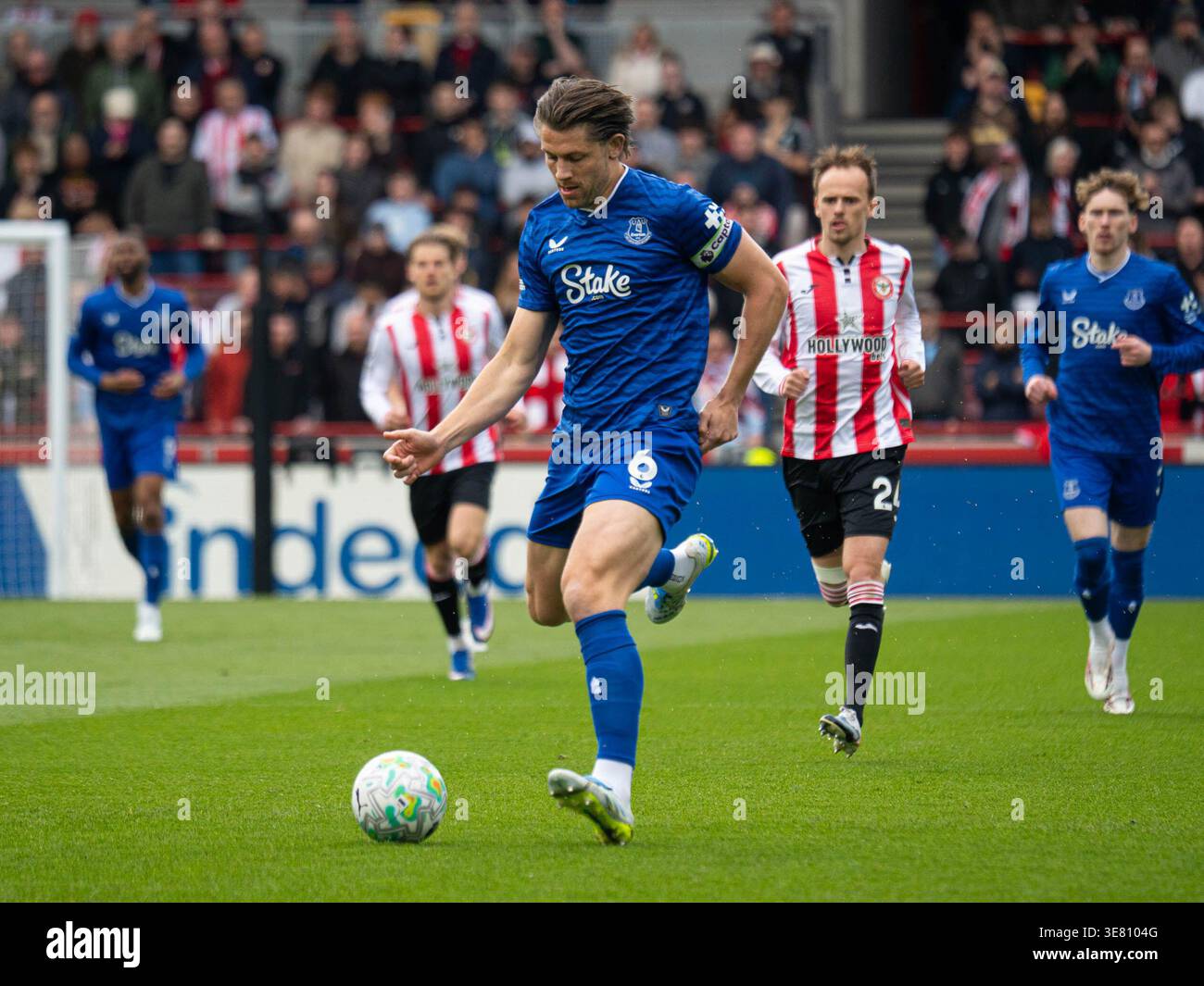 James Tarkowski passing back to the goalkeeper during, Brentford v ...