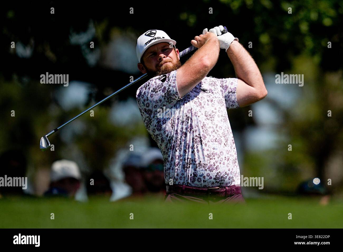 Tyrrell Hatton, of England, watches his tee shot on the fourth hole ...