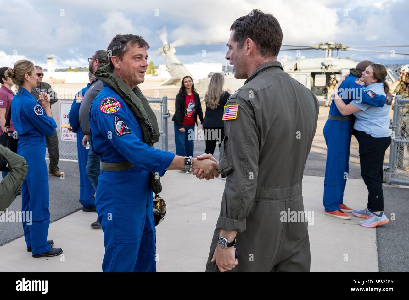 San Diego, United States. 11th Apr, 2026. NASA astronaut and Artemis II commander Reid Wiseman, left, greets Commander Naval Base Coronado Capt. Loren ��Wookie�� Jacobi, right, on arrival for medical checks to Naval Air Station North Island, April 11, 2026, near San Diego, California. The Artemis II crew of Astronauts Reid Wiseman, Victor Glover, Christina Koch and CSA astronaut Jeremy Hansen, landed safely in the Orion spacecraft after their journey to the moon and back. Credit: Keegan Barber/NASA Photo/17�Թ����� Live News Stock Photo