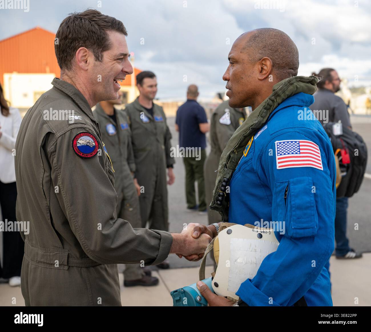 San Diego, United States. 11th Apr, 2026. NASA astronaut and Artemis II pilot Victor Glover, right, greets Commander Naval Base Coronado Capt. Loren ��Wookie�� Jacobi, left, on arrival for medical checks to Naval Air Station North Island, April 11, 2026, near San Diego, California. The Artemis II crew of Astronauts Reid Wiseman, Victor Glover, Christina Koch and CSA astronaut Jeremy Hansen, landed safely in the Orion spacecraft after their journey to the moon and back. Credit: Keegan Barber/NASA Photo/17�Թ����� Live News Stock Photo