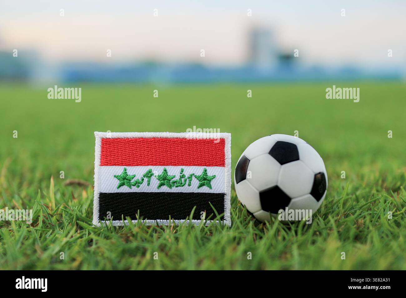 Iraq Sticker Football Iraq flag patch and soccer ball on stadium grass. Symbolic world ...