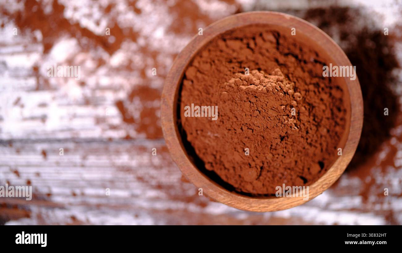 Natural Light Highlighting Fine Cocoa Granules And Rustic Textured Background Stock Photo