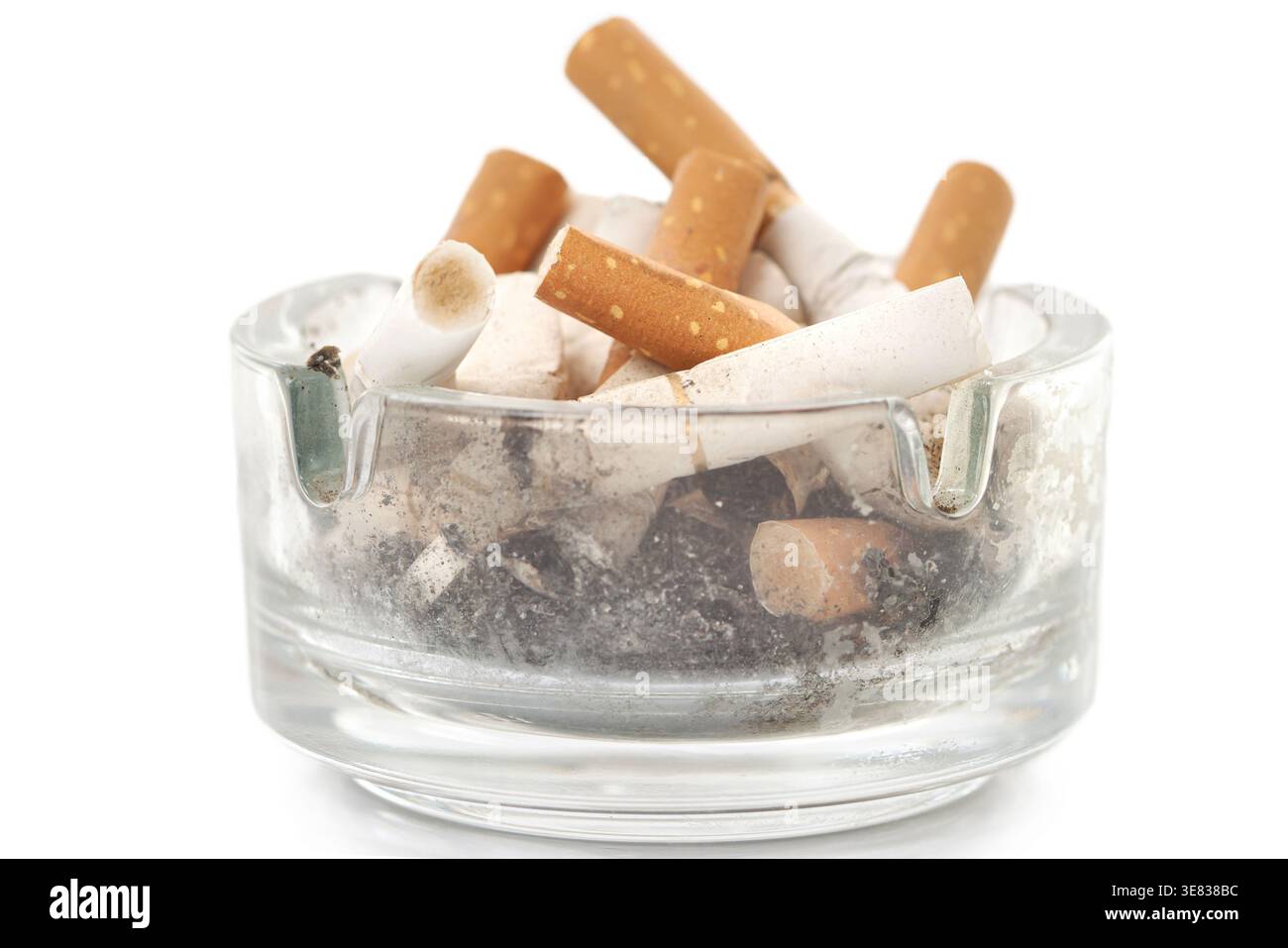 Bunch used cigarettes inside ashtray isolated white background Stock Photo