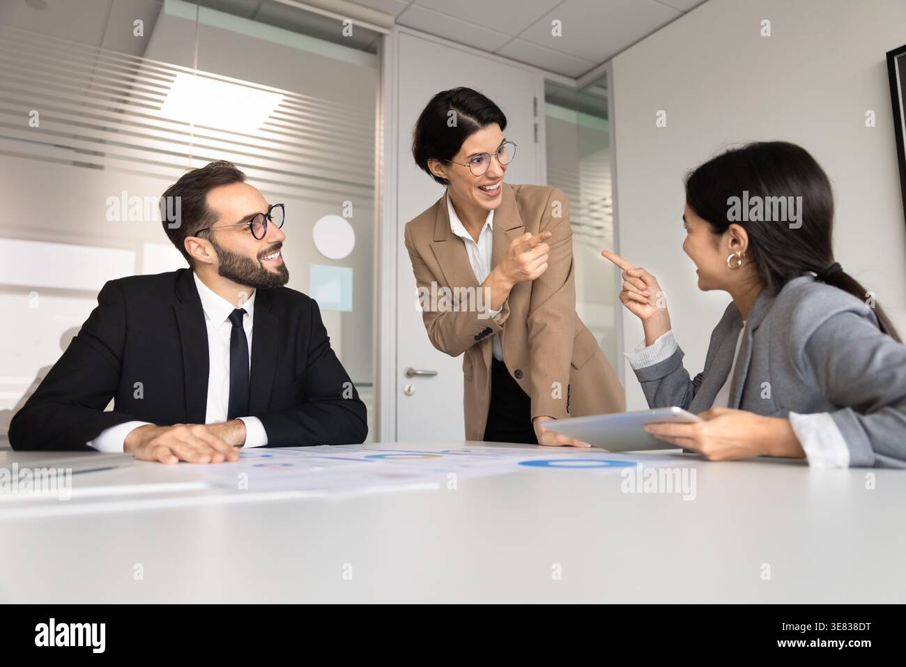 Multiethnic team smiling, finding solution, enjoy friendly teamwork in office Stock Photo