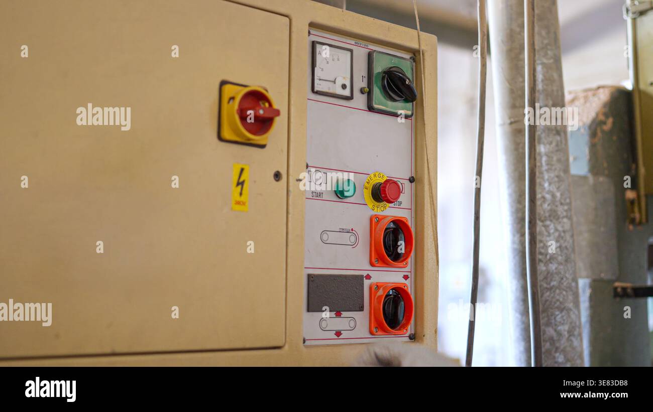 Industrial equipment control panel with emergency stop button Stock Photo