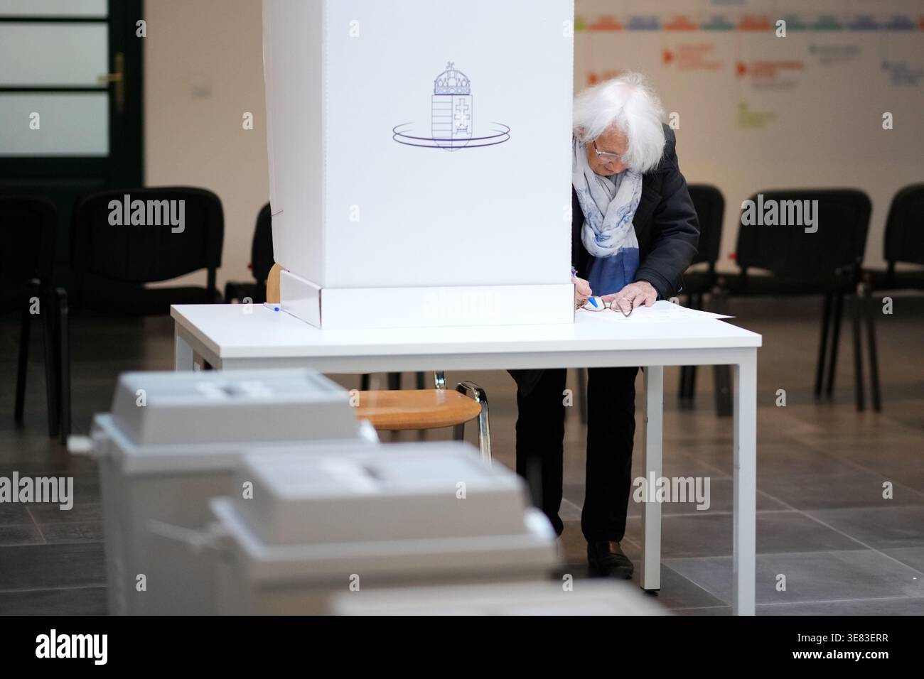 Polling Ballet A woman prepares to cast his ballot at a polling station in Budapest ...