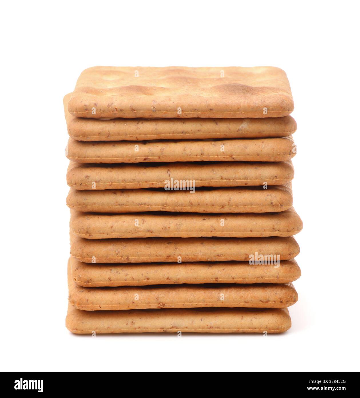 Stack of square wholegrain crackers isolated on white Stock Photo