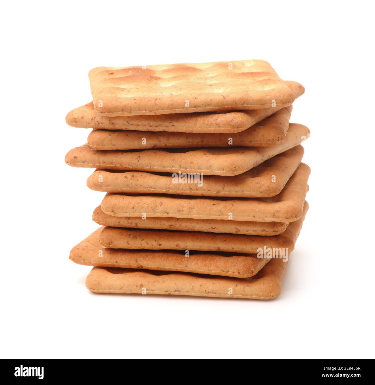 Stack of square wholegrain crackers isolated on white Stock Photo
