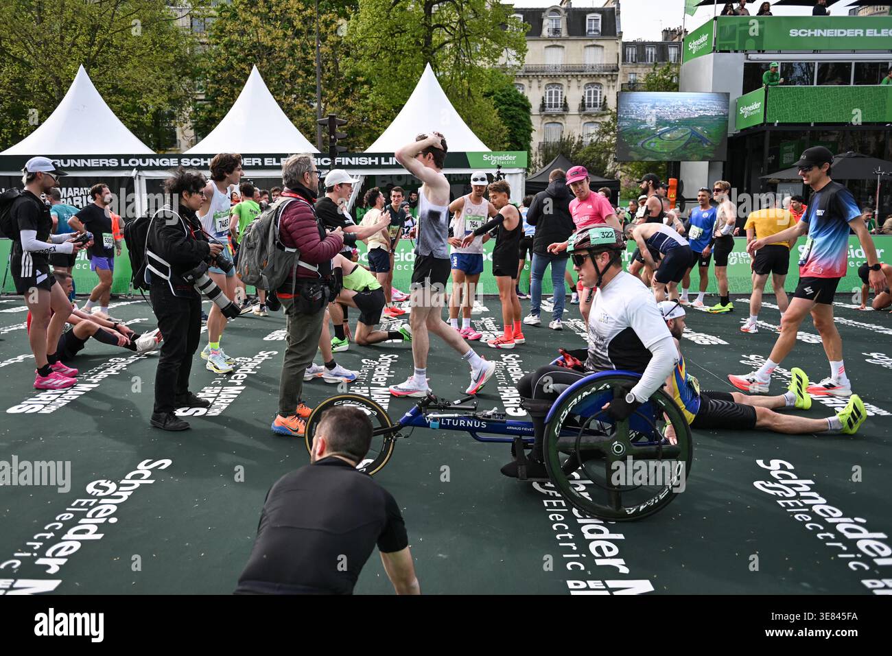 Finish Line Course Paris, France. 12th Apr, 2026. Runners arrive at the finish line during ...