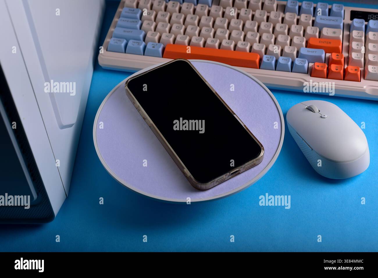 Modern workspace featuring cellphone Stock Photo