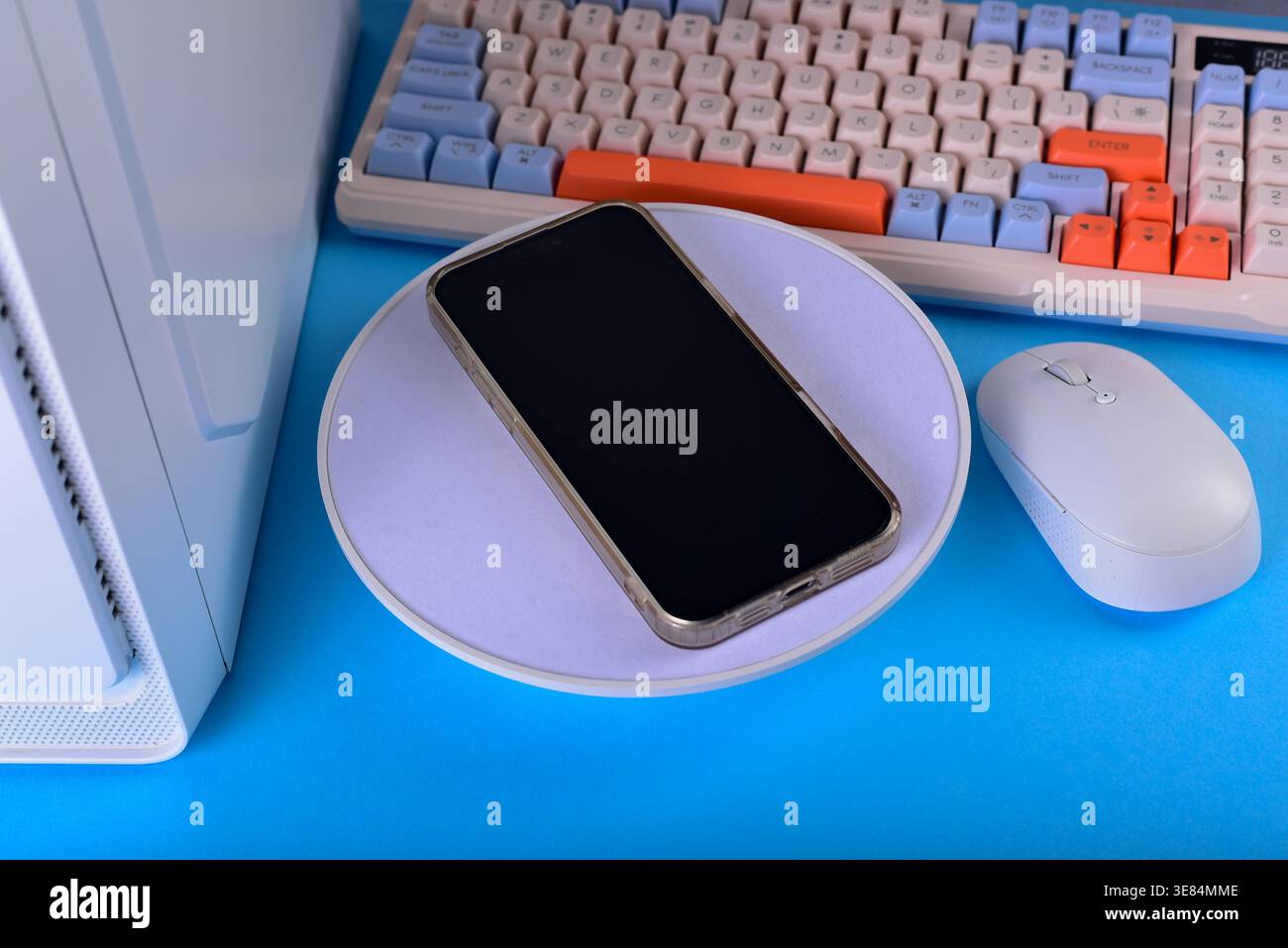 Modern workspace featuring cellphone Stock Photo