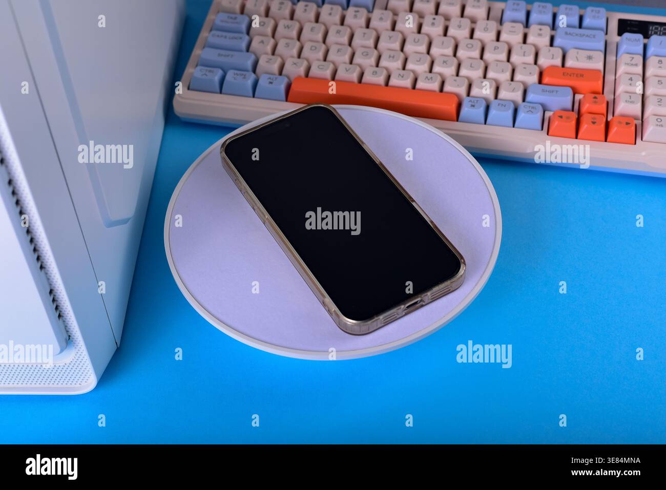Modern workspace featuring cellphone Stock Photo