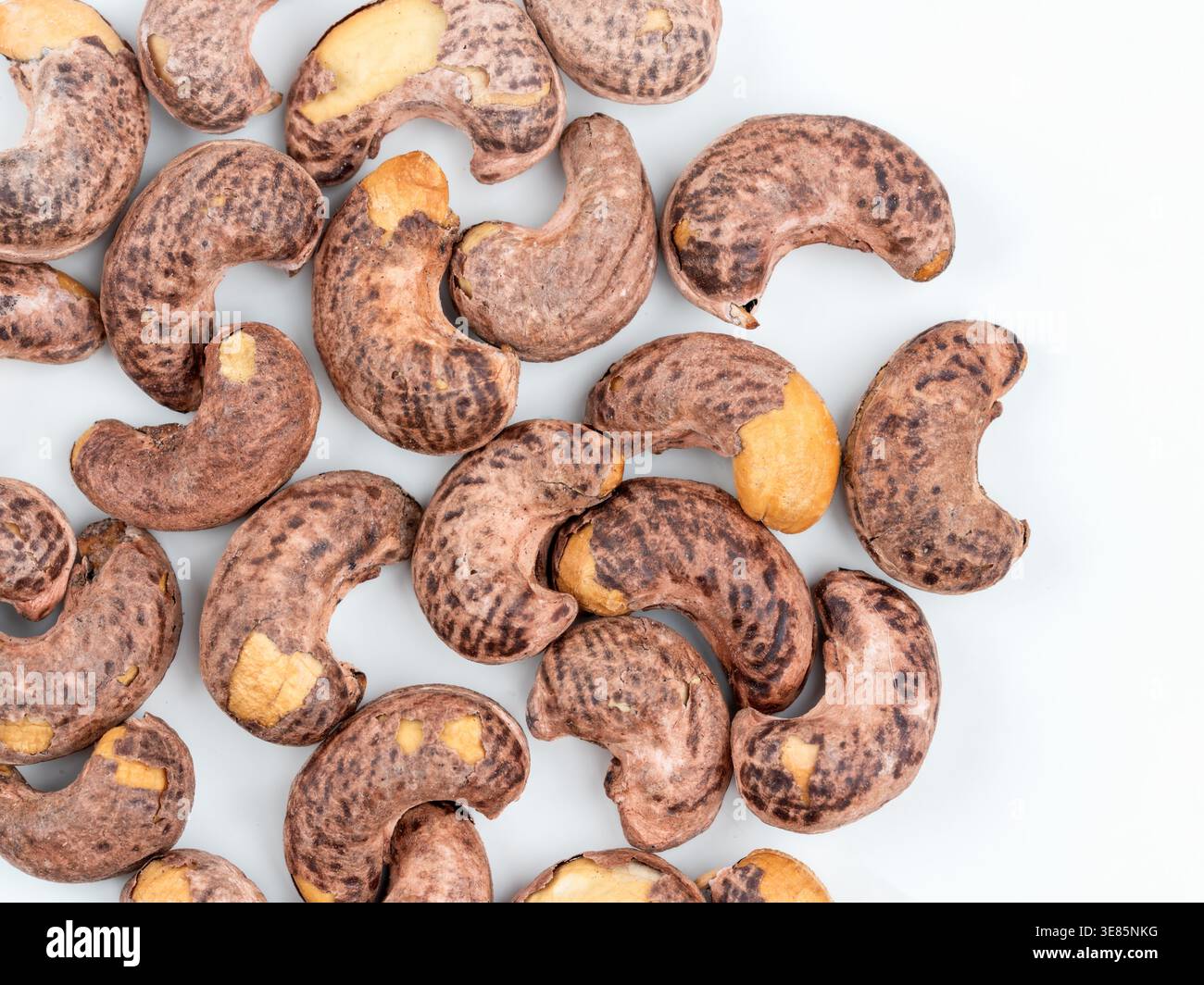 Cashew nuts in shell on light background, top view Stock Photo