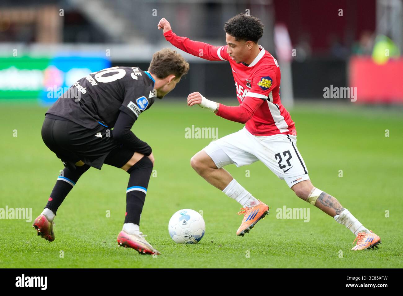 ALKMAAR, 12-04-2026, AFAS stadium, season 2025/2026, Dutch Eredivisie  football, match between AZ and SC Heerenveen, Picture shows SC Heerenveen  player Jacob Trenskow, AZ player Ro-Zangelo Daal (Photo by Pro Shots/Sipa  USA) Credit: