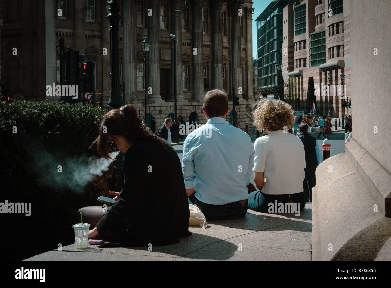 London street scene with City workers on lunch break, City of London, UK Stock Photo