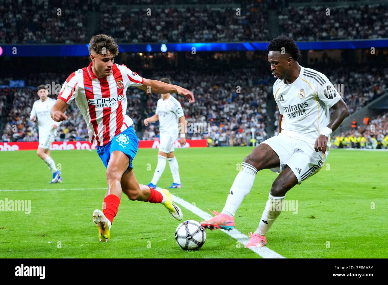 Vinicius Junior of Real Madrid CF and Hugo Rincon of Girona FC during ...