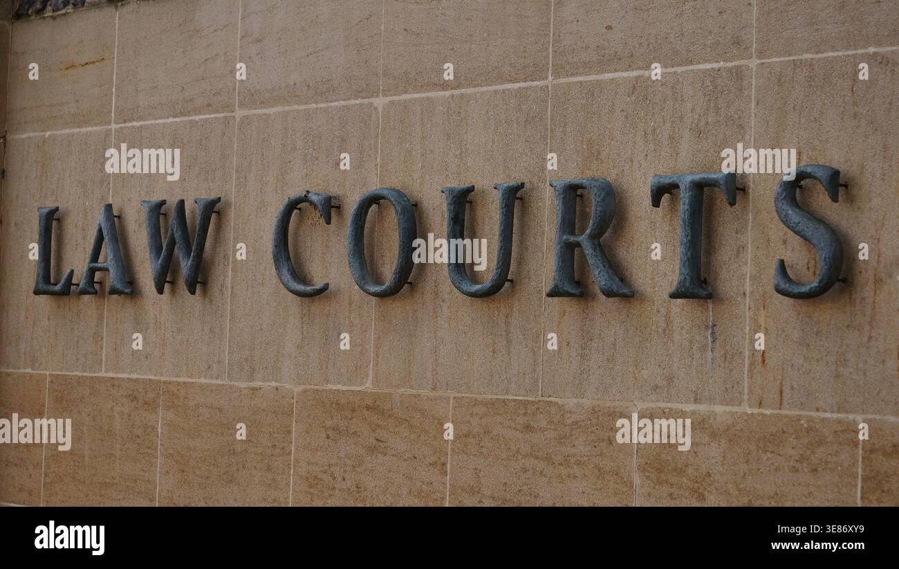 The Law Courts sign outside Winchester Crown Court, UK Stock Photo - Alamy
