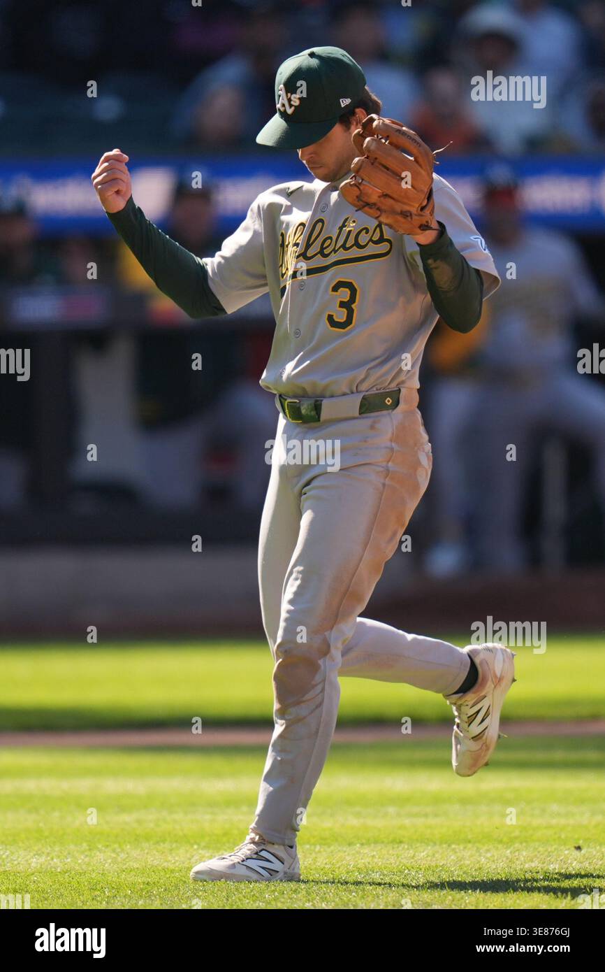 Oakland Athletics third baseman Max Muncy reacts after making a throw ...