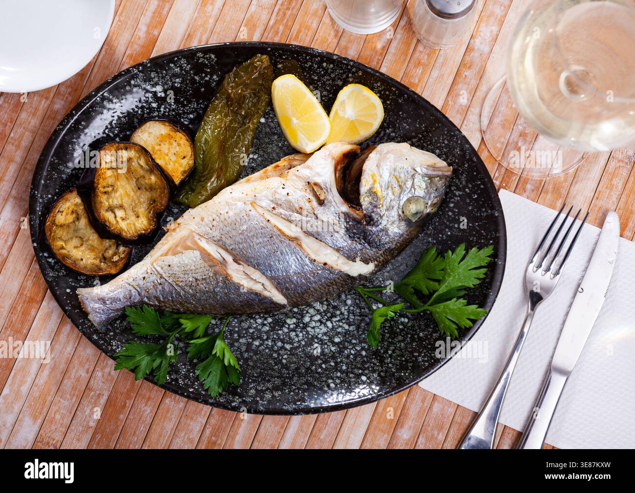 Delicious grilled gilthead bream with lemon Stock Photo