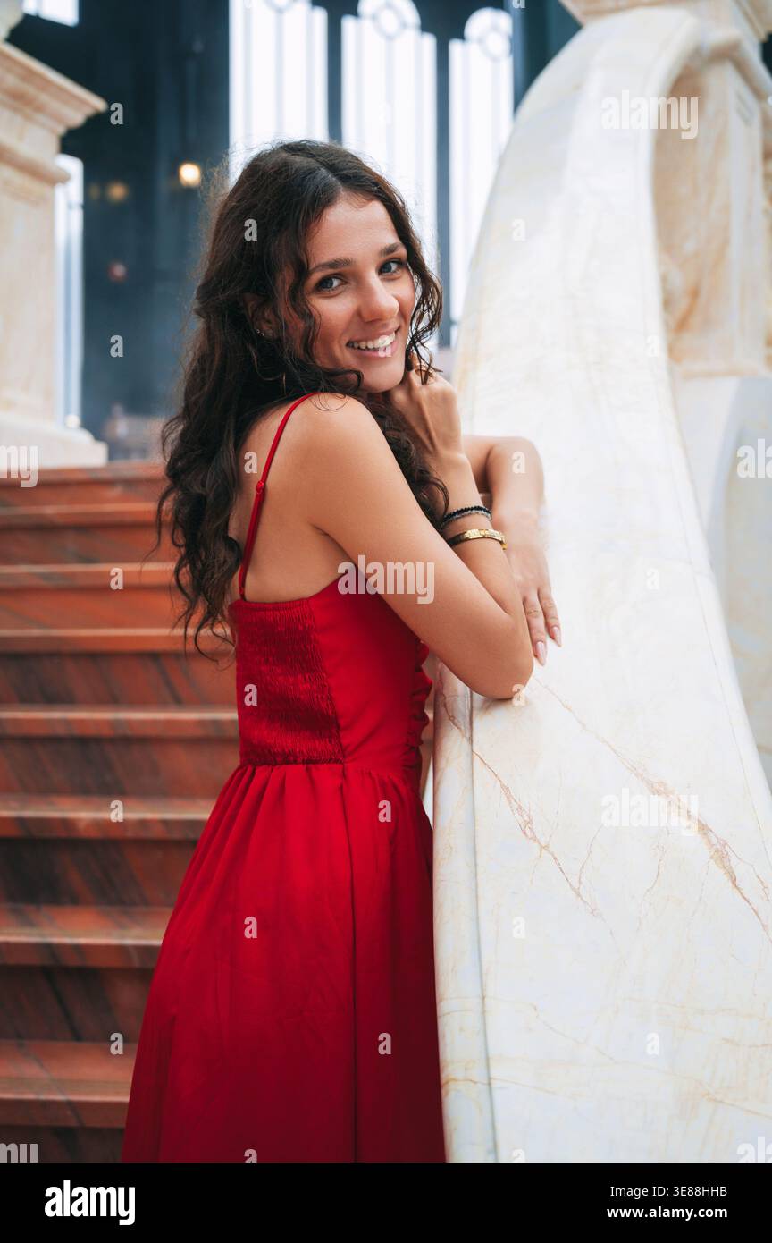 Charming lady in red dress hi-res stock photography and images - Alamy
