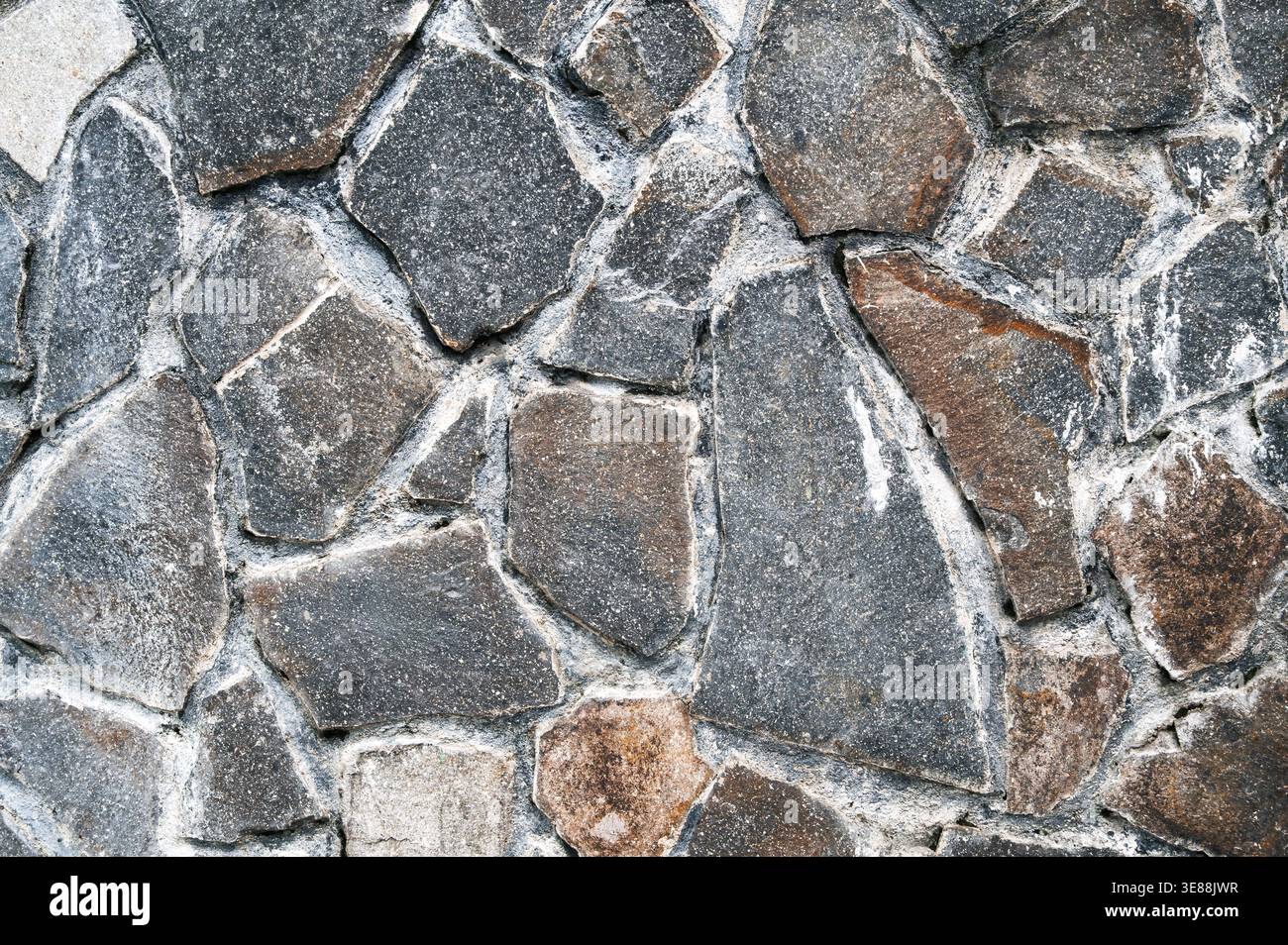 Wall or floor cladding with uneven stone slab texture Stock Photo