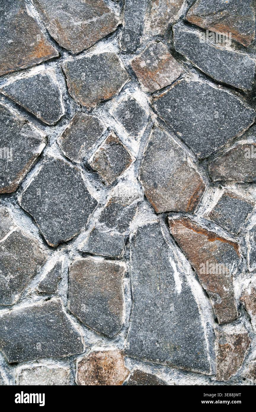 Wall or floor cladding with uneven stone slab texture Stock Photo