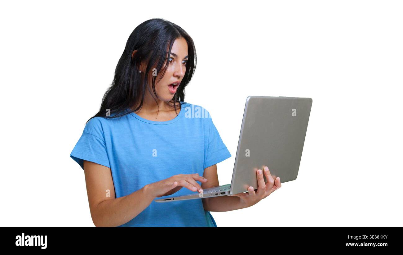 Woman reacting with surprise while using laptop Stock Photo