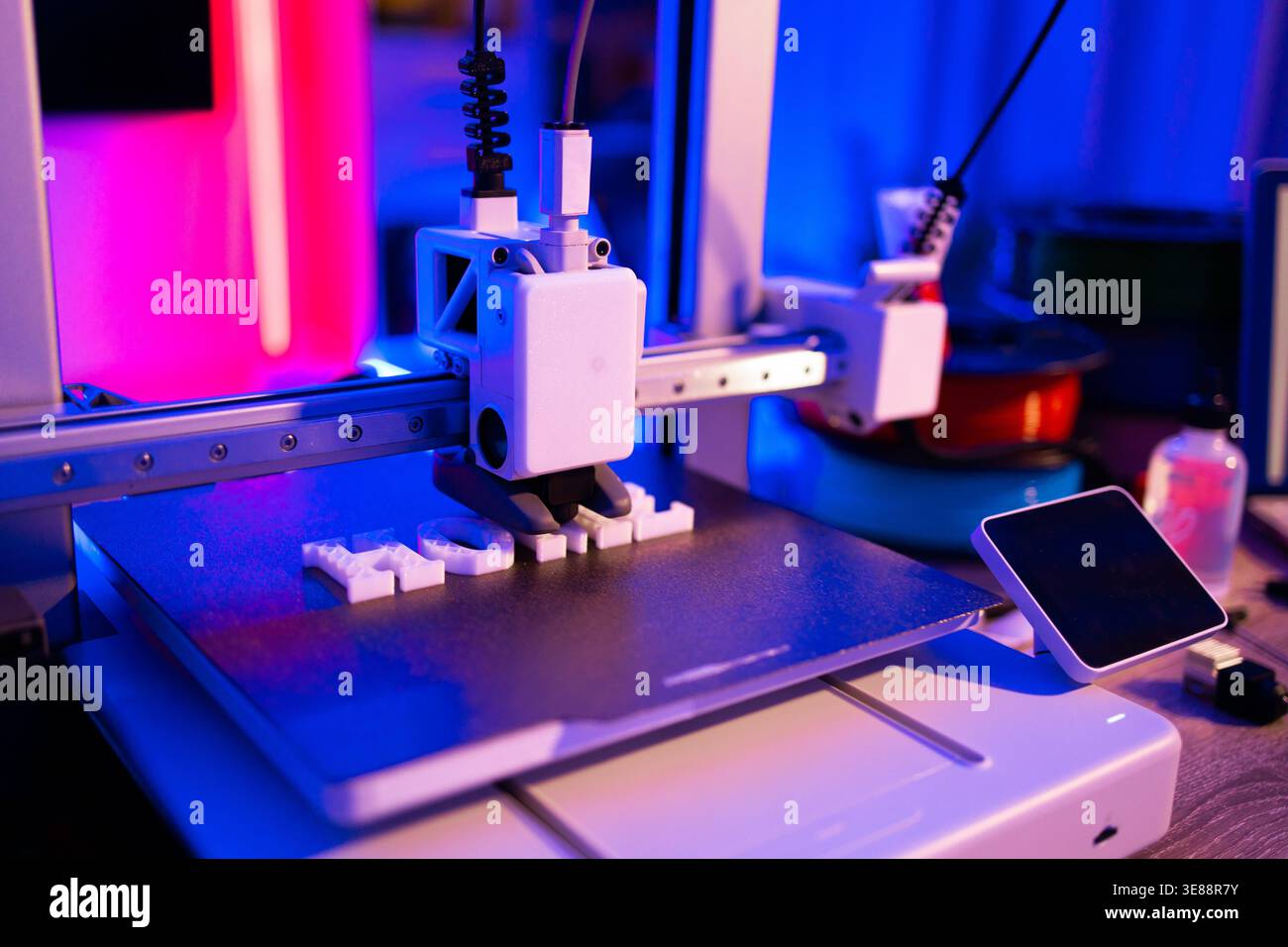 3D Printer Creating Letters Stock Photo