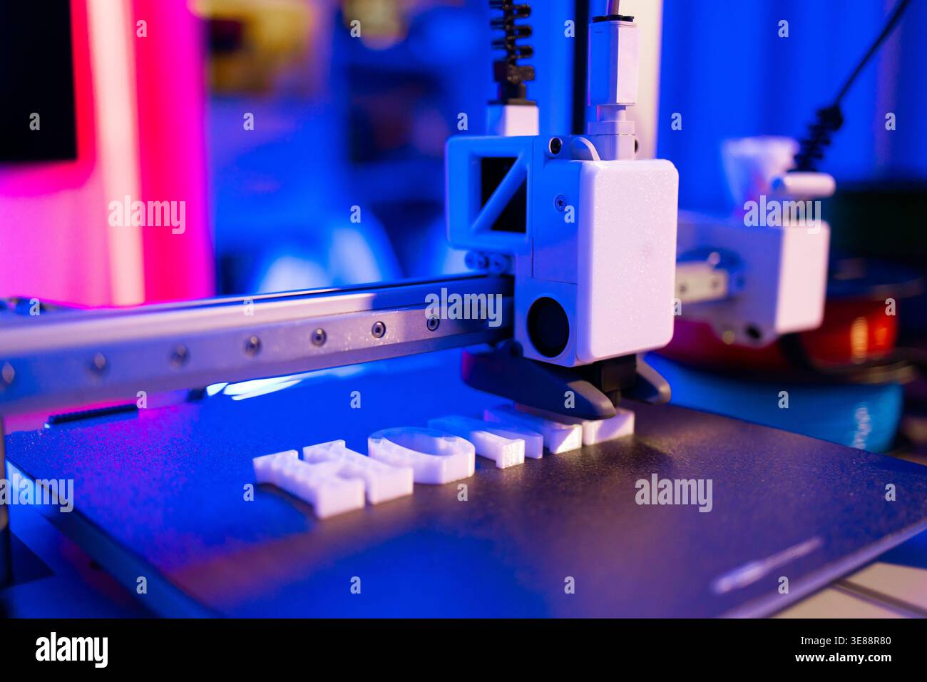 3D Printer Creating White Letters Stock Photo
