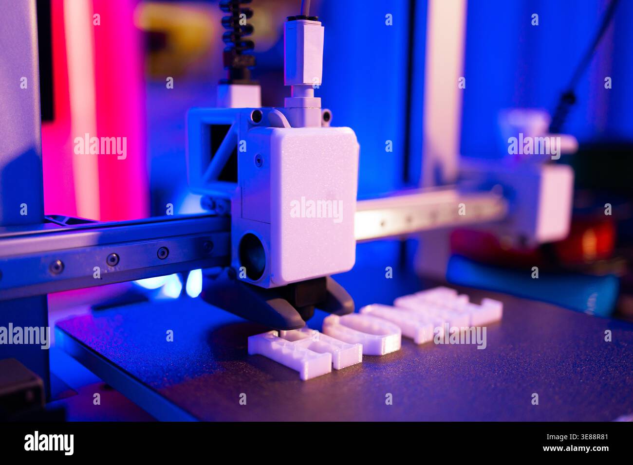 3D Printer Creating White Letters Stock Photo