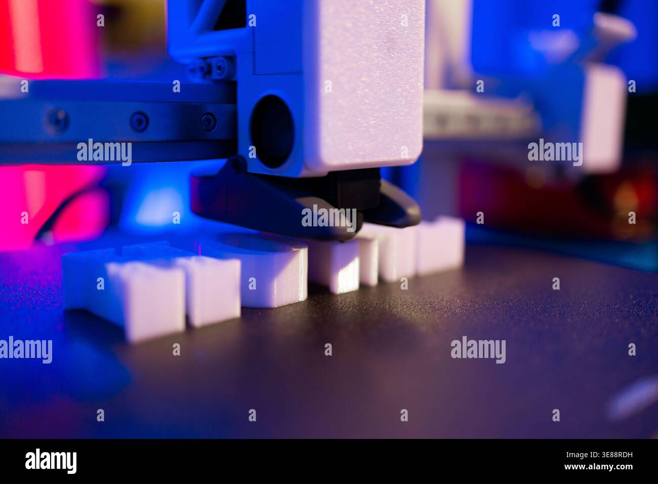 3D Printer Creating White Objects Stock Photo