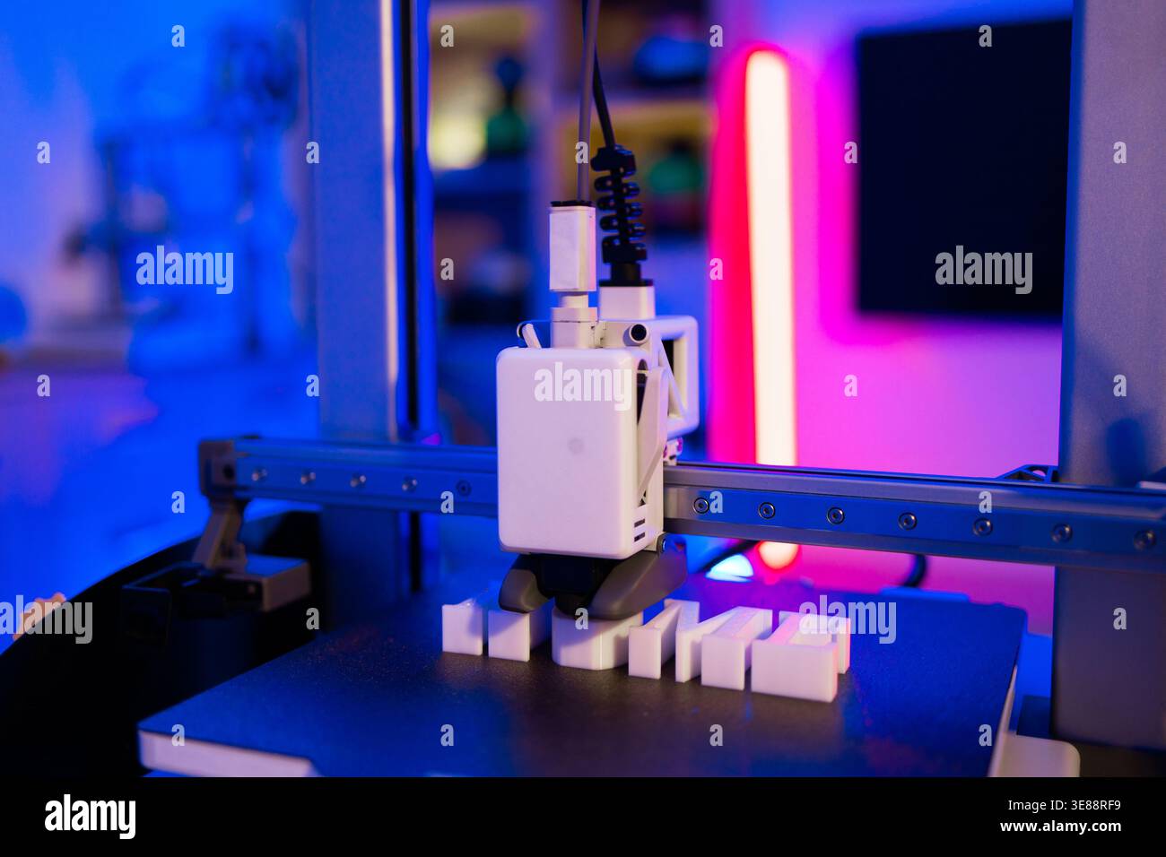 3D Printer Creating White Letters Stock Photo