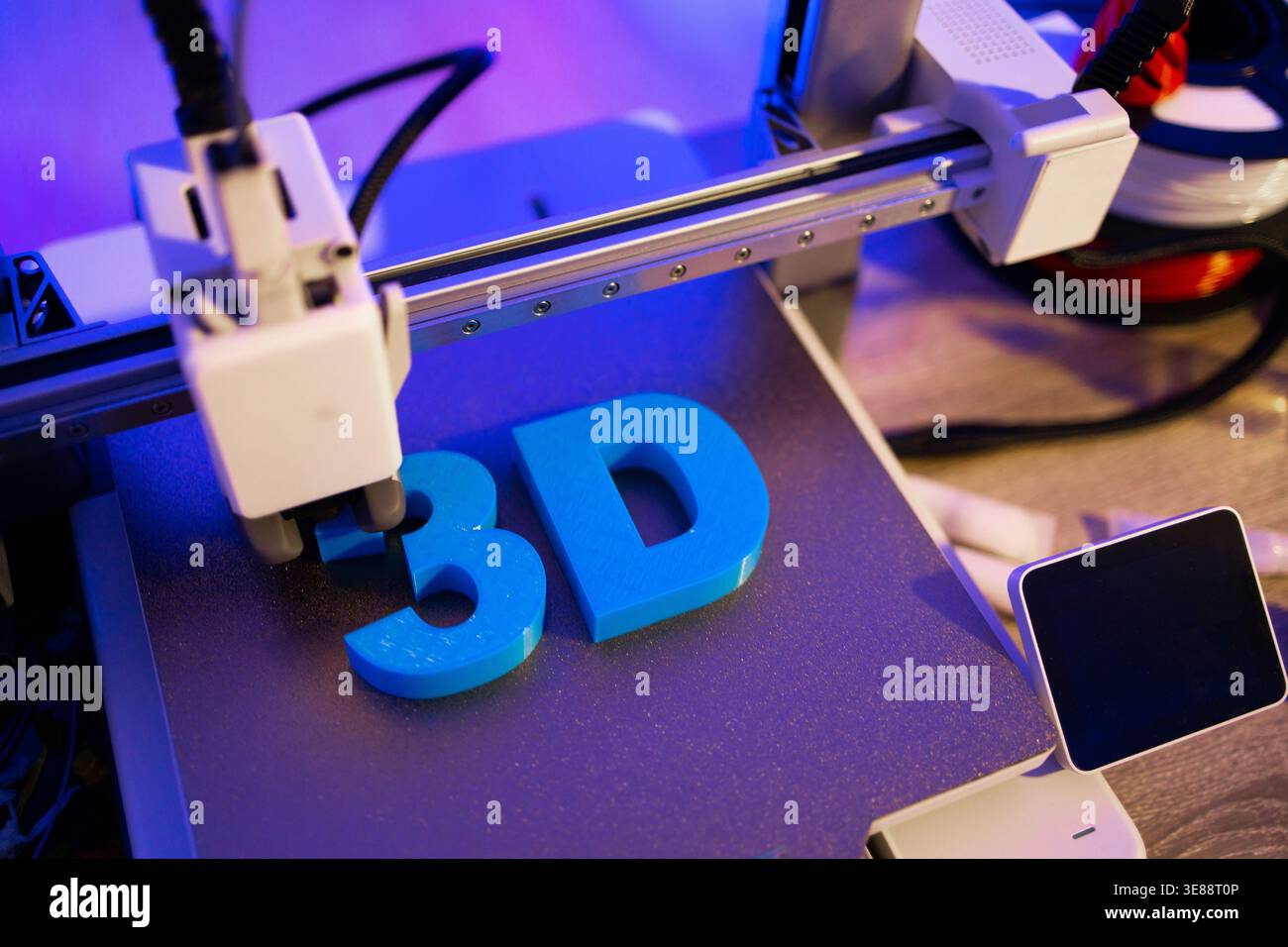 3D Printer Creating Letters Stock Photo