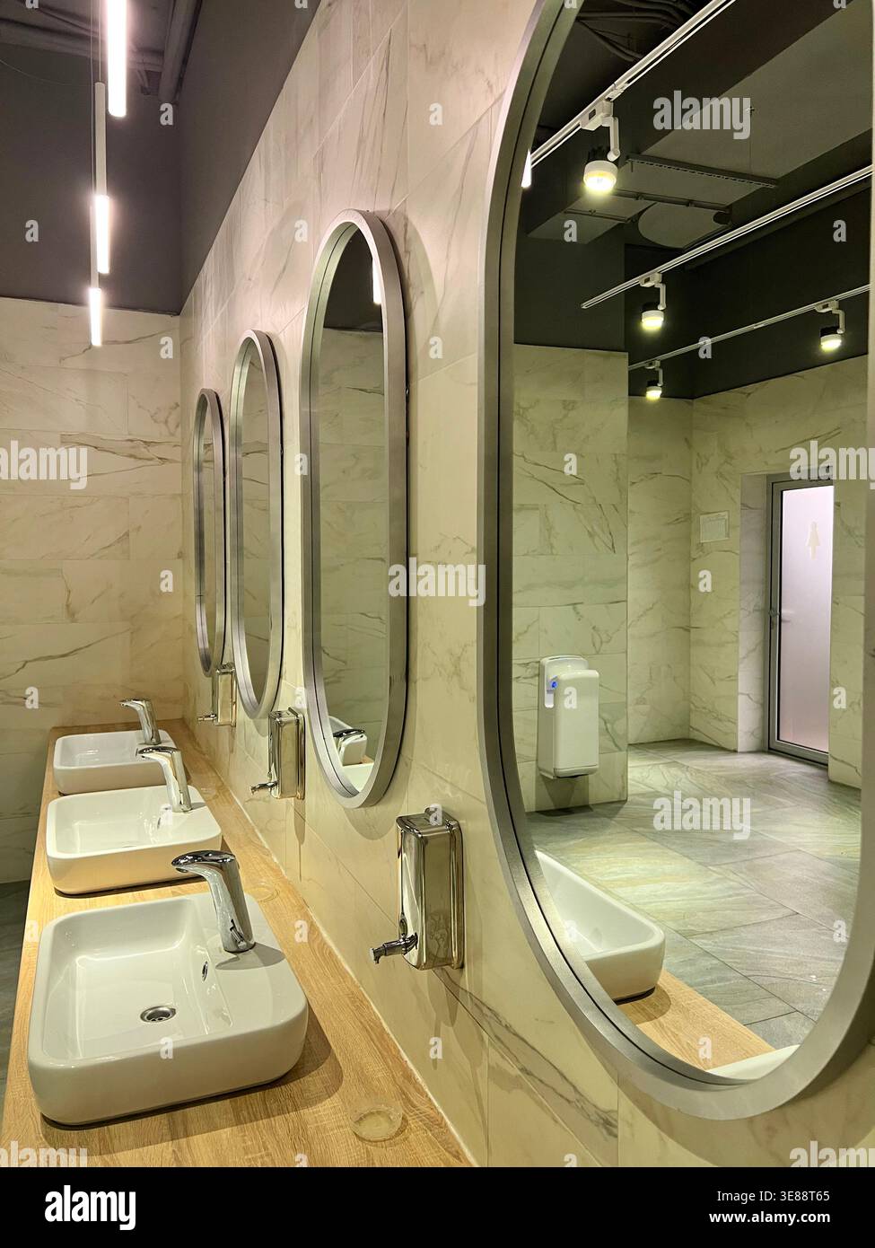 Modern restroom interior with stone gray tiles. interior of public ...