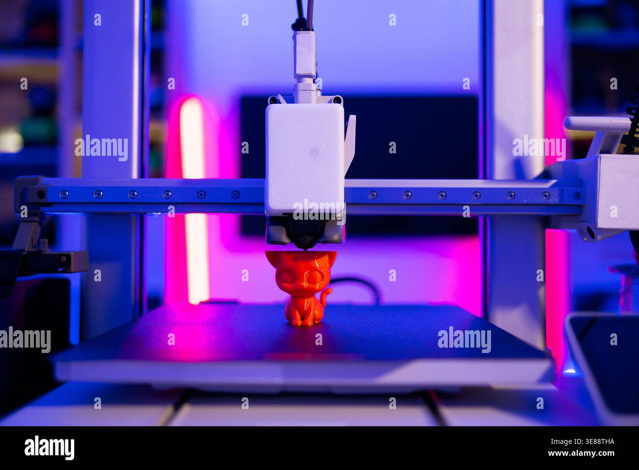 3D Printer Creating Cat Figurine Stock Photo