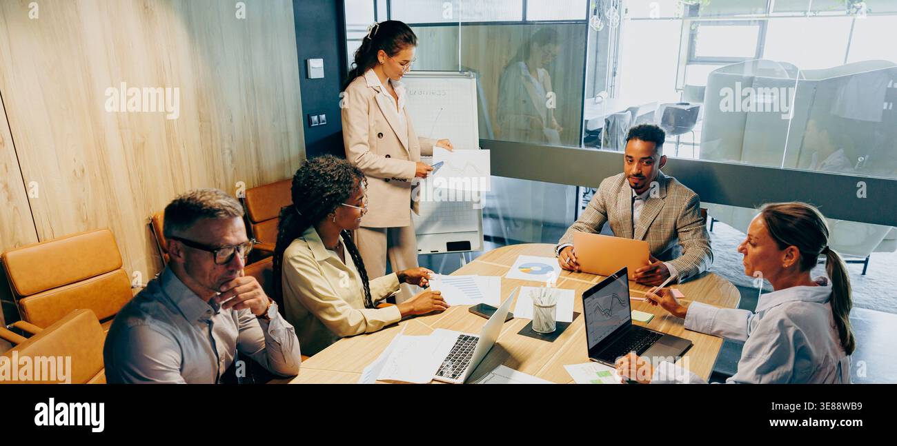 Inclusive team engaging in collaborative problem solving Stock Photo