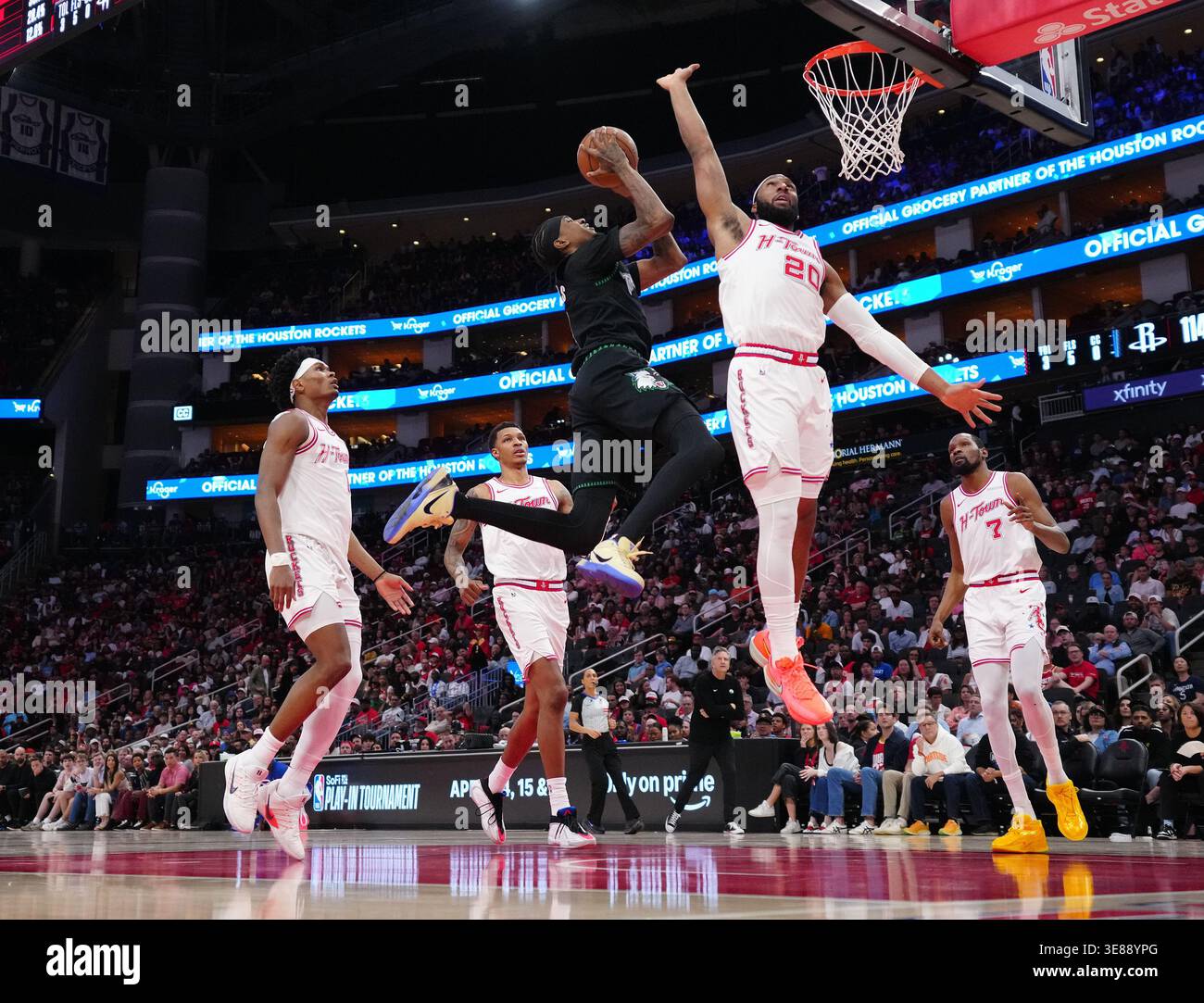 Houston Rockets guard Josh Okogie, right, defends the basket against ...