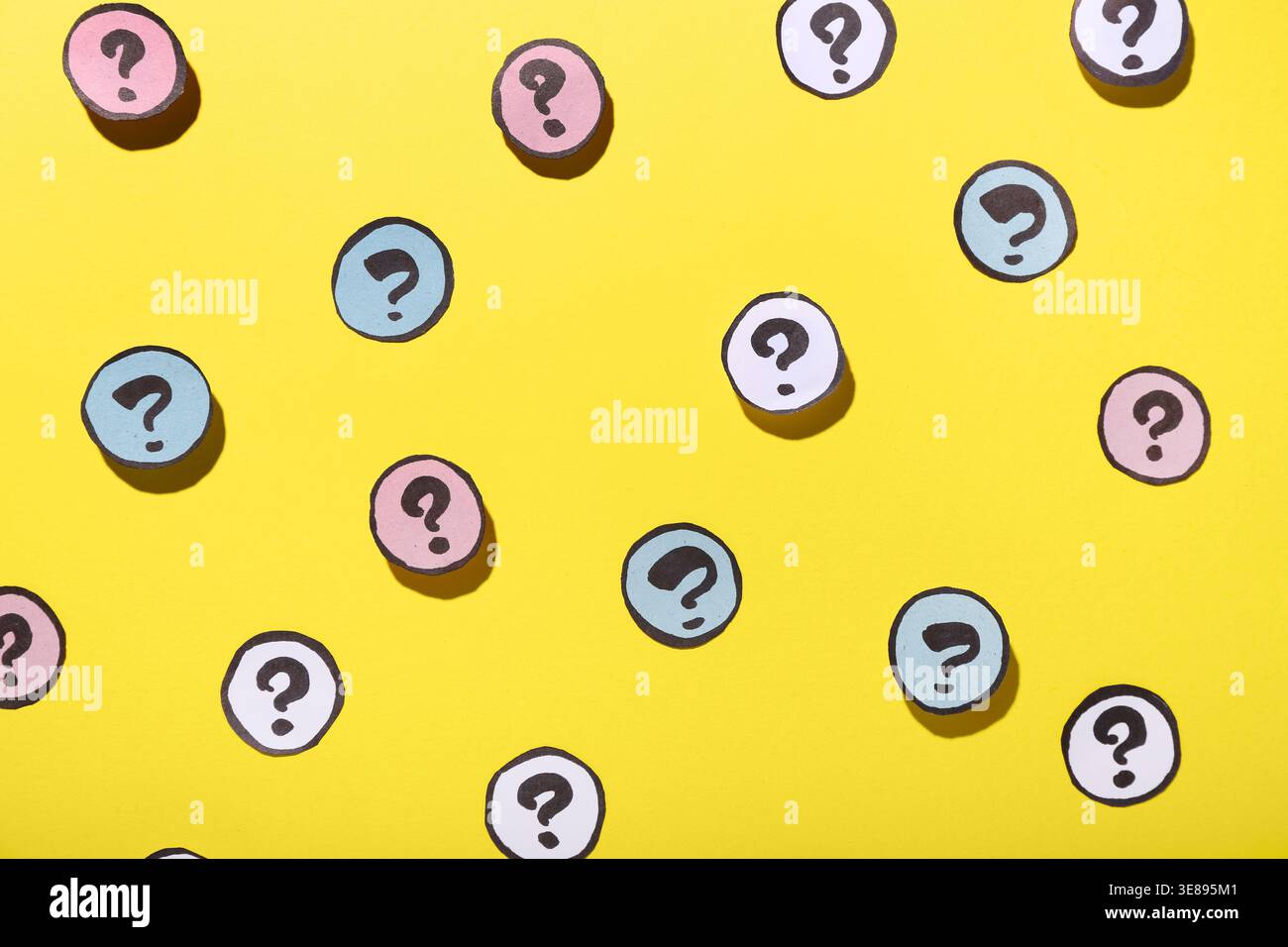 Different question marks on yellow background Stock Photo