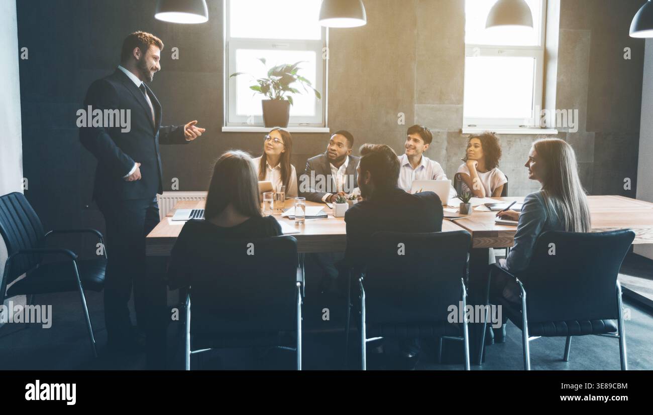 Business colleagues discussing project plans in office Stock Photo