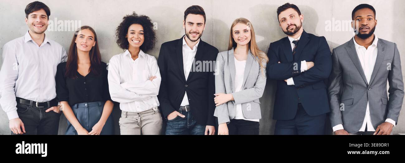 Diverse business team smiling to camera in office Stock Photo