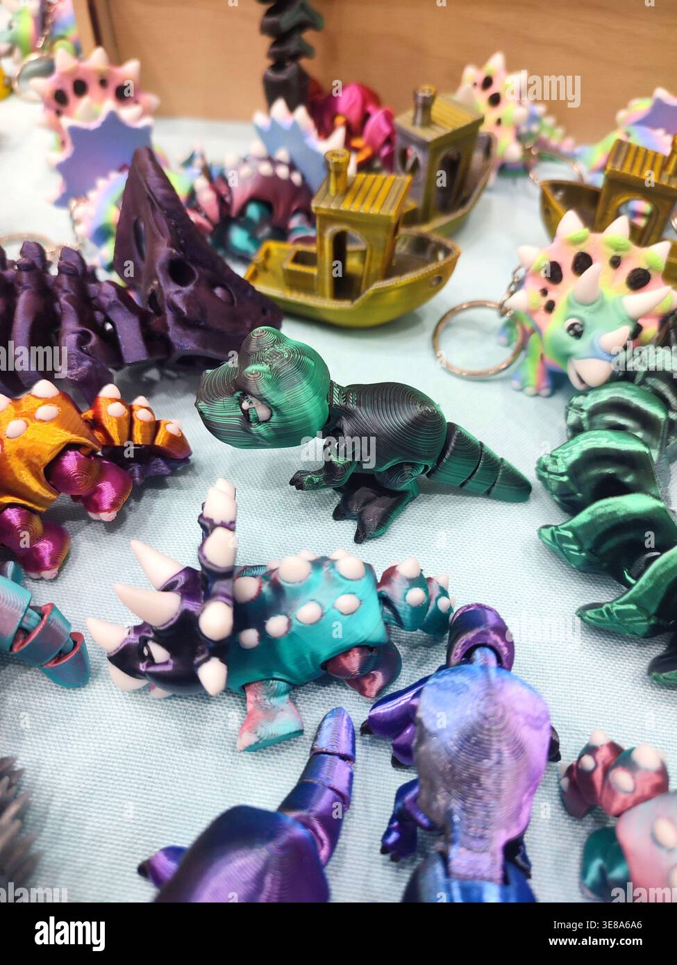 3D printed different art objects. Objects printed on 3D printer from melted colored plastic. Multicolored models created on 3D printer from threads of molten plastic. Modern new additive technologies Stock Photo