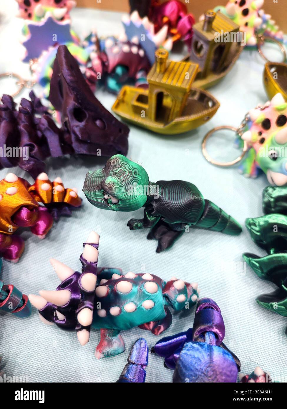 3D printed different art objects. Objects printed on 3D printer from melted colored plastic. Multicolored models created on 3D printer from threads of molten plastic. Modern new additive technologies Stock Photo