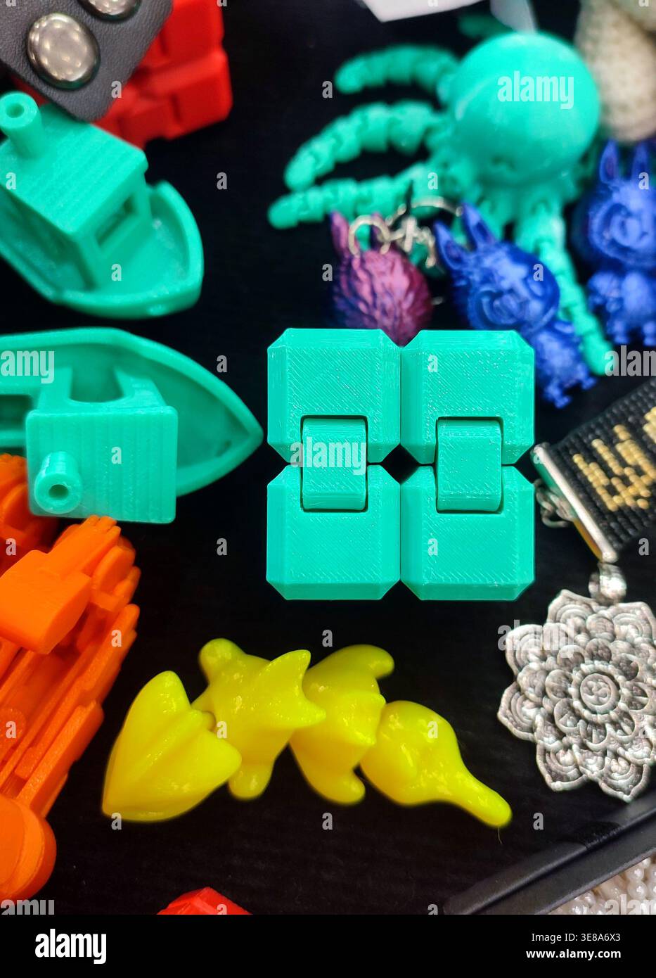 3D printed different art objects. Objects printed on 3D printer from melted colored plastic. Multicolored models created on 3D printer from threads of molten plastic. Modern new additive technologies Stock Photo