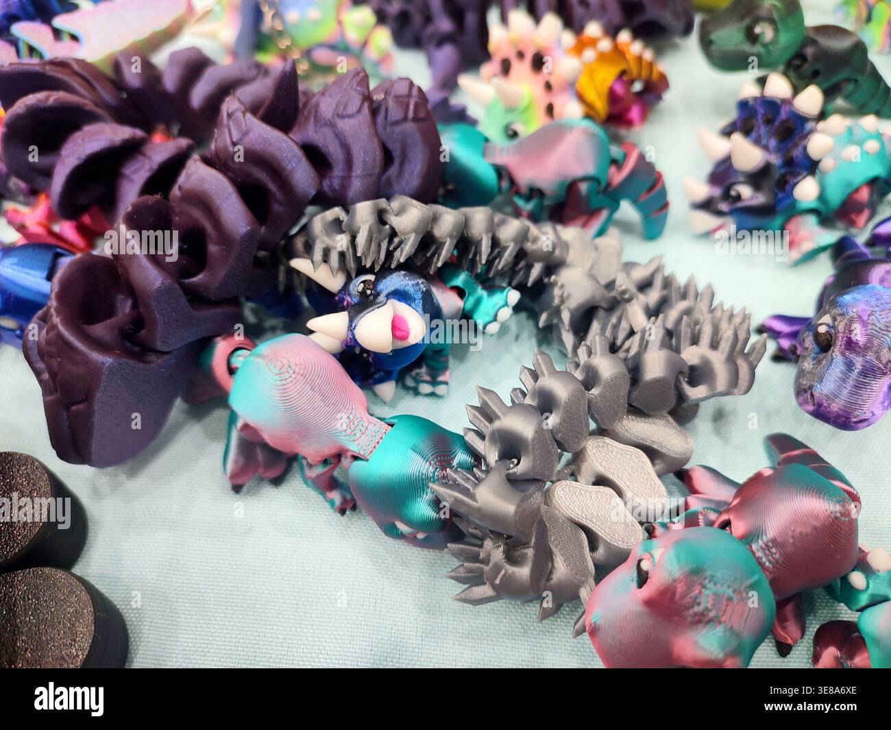 3D printed different art objects. Objects printed on 3D printer from melted colored plastic. Multicolored models created on 3D printer from threads of molten plastic. Modern new additive technologies Stock Photo