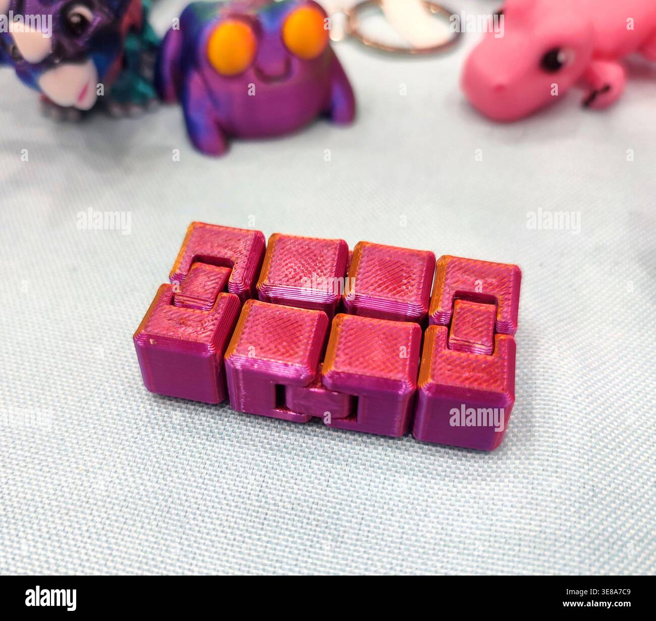 3D printed different art objects. Objects printed on 3D printer from melted colored plastic. Multicolored models created on 3D printer from threads of molten plastic. Modern new additive technologies Stock Photo
