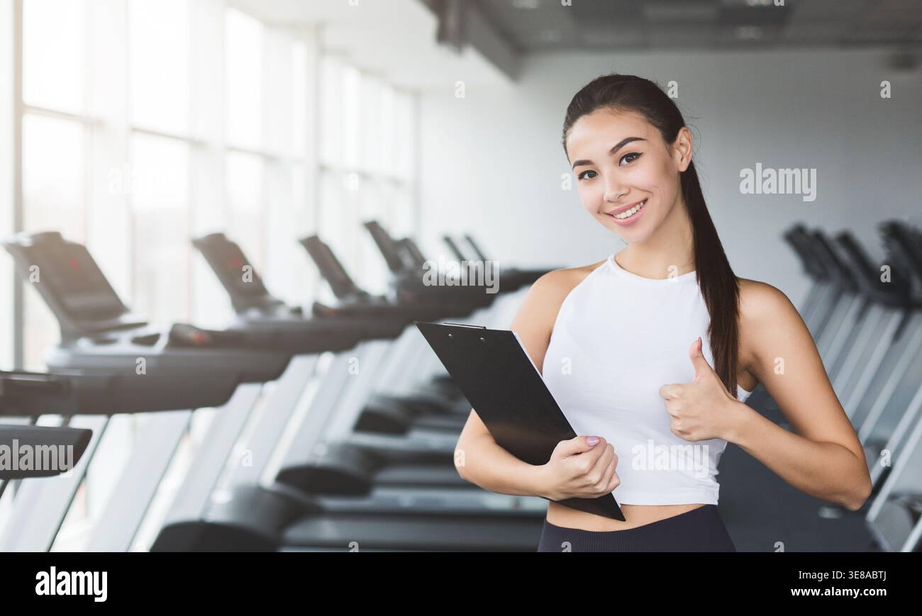 Young woman displays physical strength hi-res stock photography and ...
